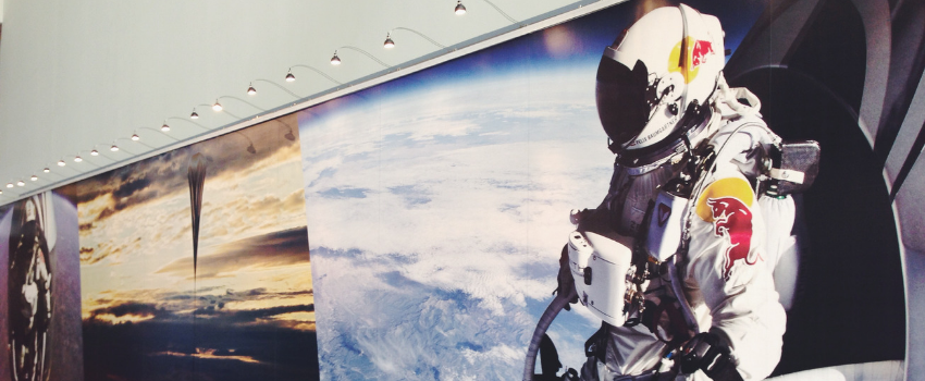 Wall mural of a person in a space suit in space.