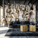 Decal of Roman Statues on wall in front of a couch. 