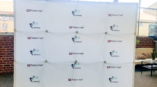 Large white step and repeat banner for Robert Half and WRMSDC.